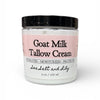 Jar of Goat Milk Tallow Cream with a black lid on a white background