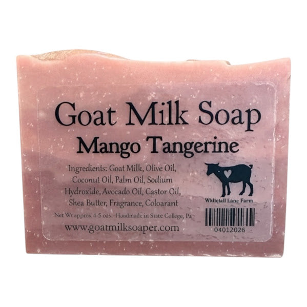 Bar of goat milk soap with 'Mango Tangerine' scent on a white background